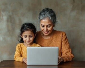 Fototapete - Warm Minimalist Home Workspace Indian Mother and Daughter Engaged in Online Learning on Laptop - EdTech Trends and Family-Oriented Digital Education Solutions