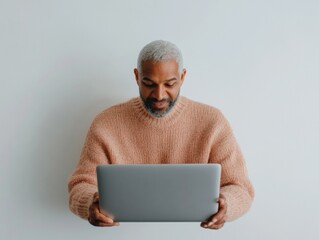 Poster - Contemporary Tech Workspace Silver Laptop with Mature Indian Man, 30s, Engaged in Remote Collaboration - Modern Education and Digital Tutoring Solutions for Diverse Professionals