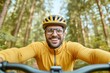 © Ryzhkov - Dynamic Outdoor Exploration Middle Eastern Male Biking with Activity Tracker on Forest Trail - Cutting-Edge Health Monitoring and Environmental Awareness for Wellness Campaigns