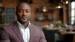 © JO BLA CO - A well-dressed man sits at a table in a modern restaurant adorned with brick walls and warm lighting. He exudes confidence and charm while enjoying the ambiance