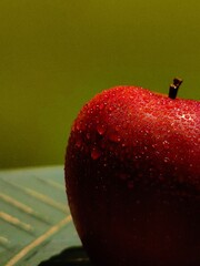 Wall Mural - Red apple. Freshly washed apple with water droplets on the surface.