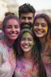 © Oleg - Group of young people celebrating Holi with vibrant colors on their faces and clothes.