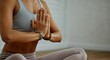 © Alexandr - Woman practicing yoga with hands in prayer position, promoting mindfulness