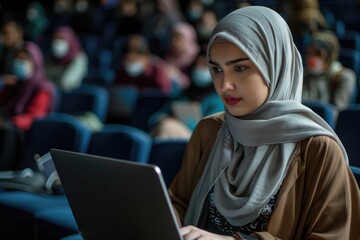 Poster - Arab woman in hijab at tech conference using laptop.