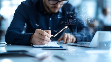 Aufkleber - A focused professional analyzes data trends while writing notes in a notebook. The environment is modern, featuring technology and digital analytics on display.