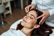© velikiyzayats - A Tranquil Spa Session: A Woman Enjoys a Rejuvenating Massage Experience Featuring a Skilled Therapist in a Calm Atmosphere