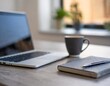 © Artbi - A sleek modern workspace with a laptop, notebook, and coffee cup on a minimalist desk, showcasing productivity and professionalism.