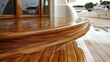 © mlangsen - Polished teak deck entrance on yacht with marina background