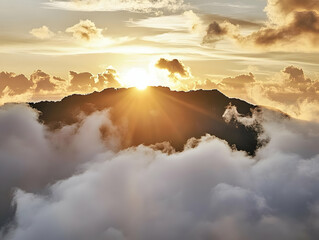 Canvas Print - Golden Sunrise Illuminates Mountain Peaks Above a Sea of Clouds at Dawn.