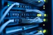 © Marko - Network server equipment with cables illuminated in a data center