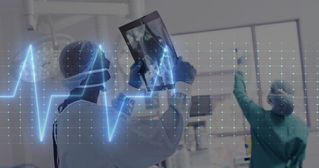 Poster - Image of cardiograph over diverse doctors inspecting xray