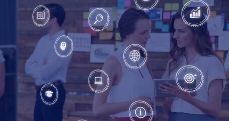 Poster - Digital icons image over businesswomen using tablet in modern office