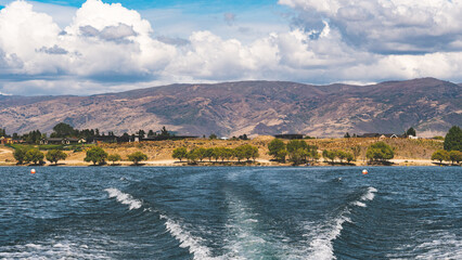 Wall Mural - Summer water activities in cromwell new zealand lake mountains hills beautiful nature landscape hot day 