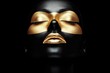 © Jeannaa - Makeup Trends Concepts. Artistic black and gold face makeup against a dark background.