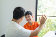 © Charlie's - Asian father and son giving a hi five father spending leisure time with child celebrating kids success relationship Family