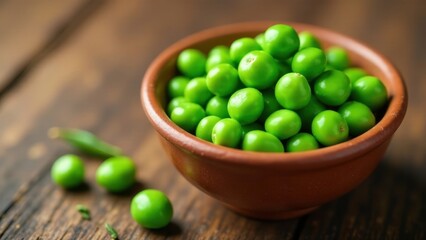 Sticker - A rustic bowl brimming with vibrant green peas, freshly harvested and ready to be enjoyed.  A few peas rest nearby on a dark wooden surface.