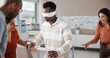 © peopleimages.com - Blindfold, coordination and team building with business people in office for communication skills development. Directions, instructions or trust with employee group in creative workplace for bonding