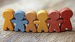 © Doukdouk/imageBROKER - Colorful wooden figures standing side by side, representing unity and diversity with a touch of simplicity, AI generated