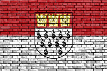 Poster - flag of cologne painted on brick wall