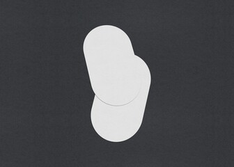 Poster - Two white oval sheets overlapping slightly on a dark background, Blank white Business card mockup stacks at grey textured paper background