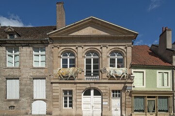 Former slaughterhouse with two bull figures on façade, Autun, Saône-et-Loire, France, Europe