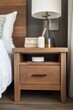 © Ева Поликарпова - A bedside table with a lamp placed on top, suitable for bedroom interior design or still life photography
