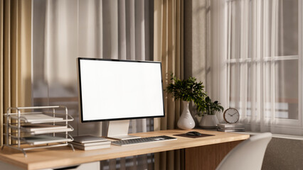 Canvas Print - a computer and decorative items on a wooden desk by the window in a cozy contemporary room.