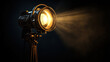 © Keopaserth - vintage theater spotlight shines brightly, illuminating dark space with warm glow, creating dramatic atmosphere