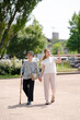 © Masakazu Tokashiki - A park with good atmosphere with canal in Toyama Prefecture. Old woman in her 90s and Japanese woman in her thirties are walking around the park.