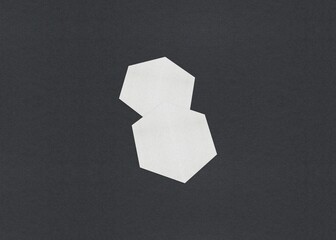 Poster - Two white hexagon shapes overlapping on a dark background, Blank white Business card mockup stacks at grey textured paper background
