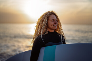 Woman with surfing board at beach, sea and ocean for summer holiday, travel adventure or hobby.