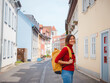 © YURII Seleznov - Tourist woman explores beautiful city of Erfurt, wandering through its historic streets, admiring charming architecture, and discovering cultural landmarks, fully immersed in citys rich heritage.