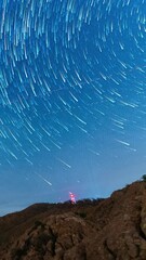 Wall Mural - majestic glowing night sky, vertical time lapse view