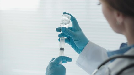 Poster - A medical professional prepares an injection with a syringe, using sterile gloves for safety. This showcases their expertise in healthcare, immunization, and commitment to patient treatment