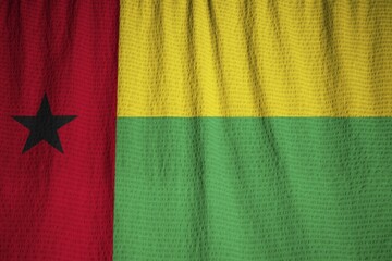 Poster - Closeup of Ruffled Guinea-Bissau Flag, Guinea-Bissau Flag Blowing in Wind