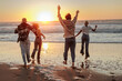 © bernardbodo - Friends running on the beach at sunset enjoying summer vacation