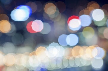 Poster - Coloured lights as fuzzy, abstract points of light with coloured lens flare