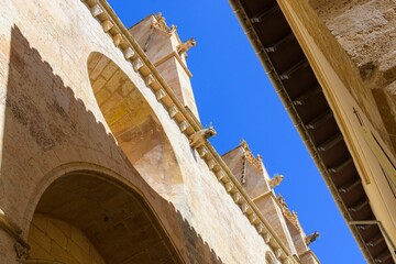 Wall Mural - Historic stone architecture under clear blue sky.