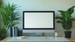 © Friedbert - Modern workspace with a computer, plants, and stationery on a desk