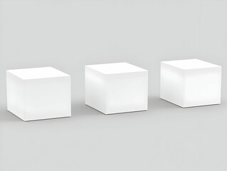 Poster - Three White Cubes Stand on a Gray Background for Product Display