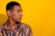 © deagreez - Stylish young man posing with tiger print shirt against a yellow background in a fashion photoshoot