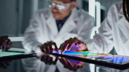 Leinwandbilder - Innovative scientists collaborate in a futuristic lab with advanced technology and holographic displays