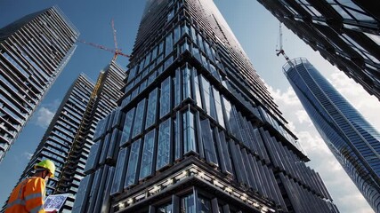 Aufkleber - Construction worker examines plans amid futuristic skyscrapers with holographic elements