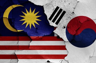 Wall Mural - Flags of Malaysia and South Korea painted on cracked wall