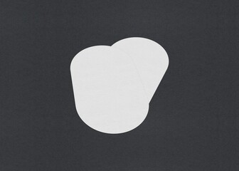 Leinwandbilder - Two plain white oval papers on a black background, Blank white Business card mockup stacks at grey textured paper background