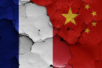 Wall Mural - Flags of France and China painted on cracked wall