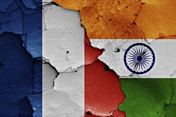 Wall Mural - Flags of France and India painted on cracked wall