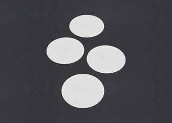 Poster - Four white circles vertically aligned on a dark background in a simple geometric pattern, Blank white Business card mockup stacks at grey textured paper background