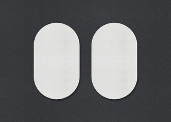 Poster - Two white oval sheets side by side on a gray background, Blank white Business card mockup stacks at grey textured paper background