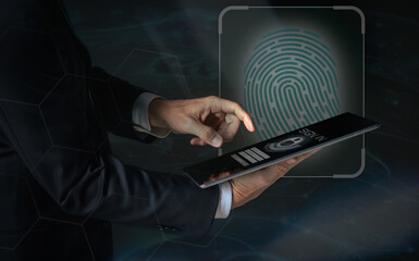 businessman uses computer pad to authenticate online and login in a web application security concept